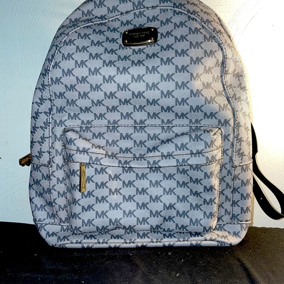 Michael Kors Handbags - Michael Kors medium sized backpack. used once. Basically new condition w/o tags